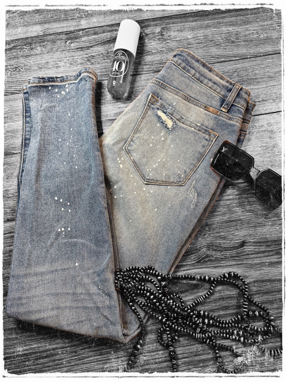KanCan Relaxed Distressed Skinny Jeans in Light Blue with Paint Splatter